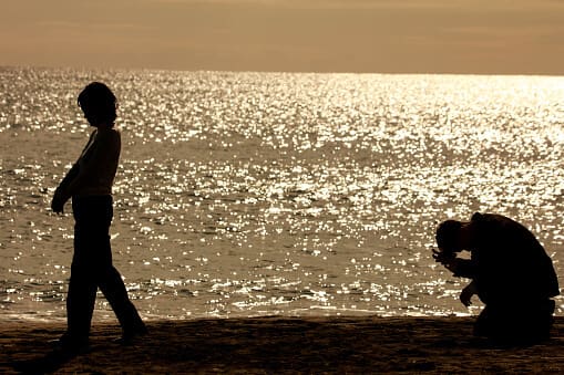Couple at beach with broken heart